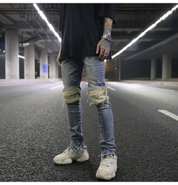 Tailored hole patch jeans